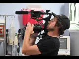 Behind the scenes with Montage Media Production Company: Operator lining up a shot on the cinema rig