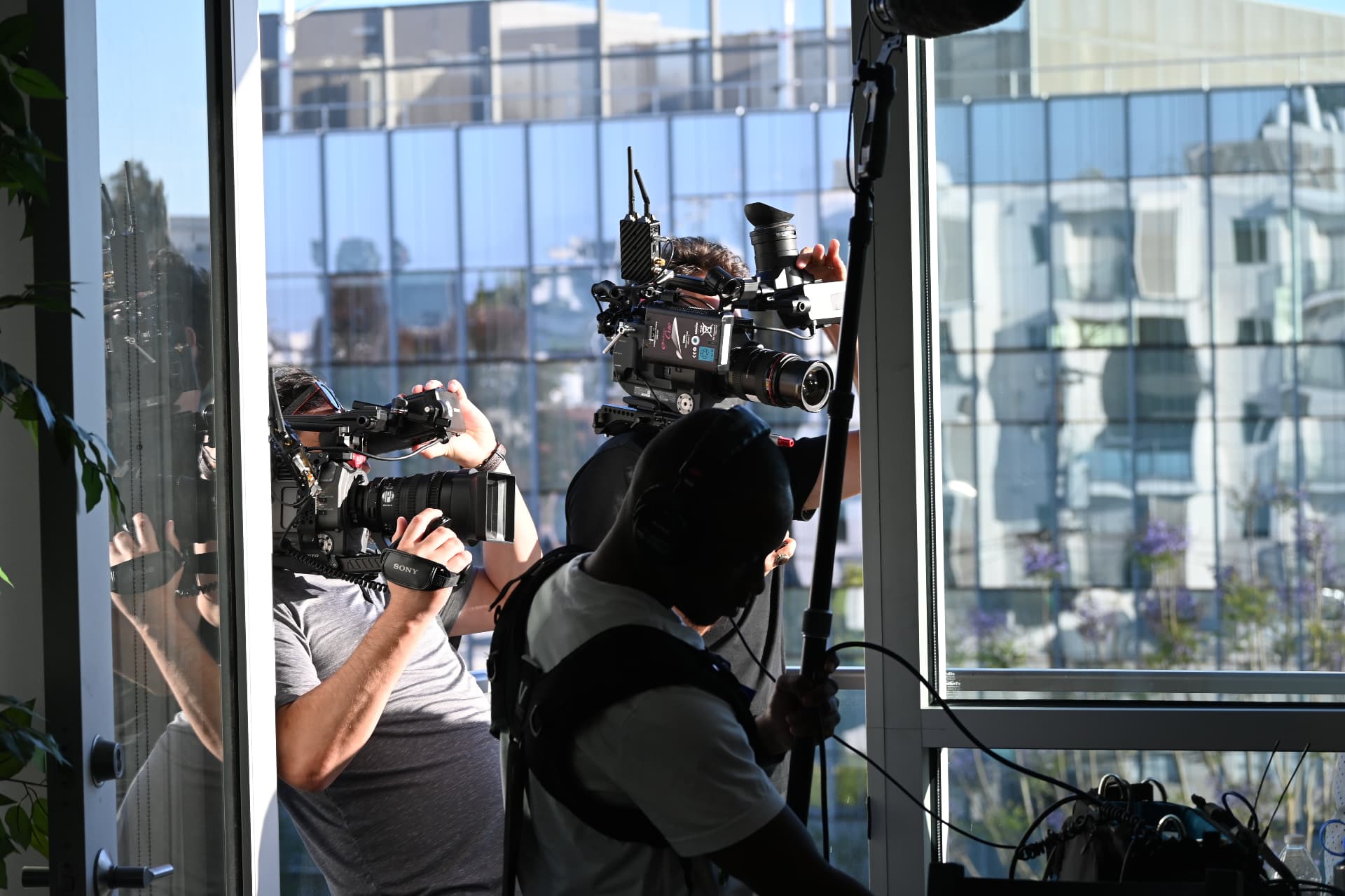Behind the scenes with Montage Media Production Company: Two camera coverage against a glass office wall
