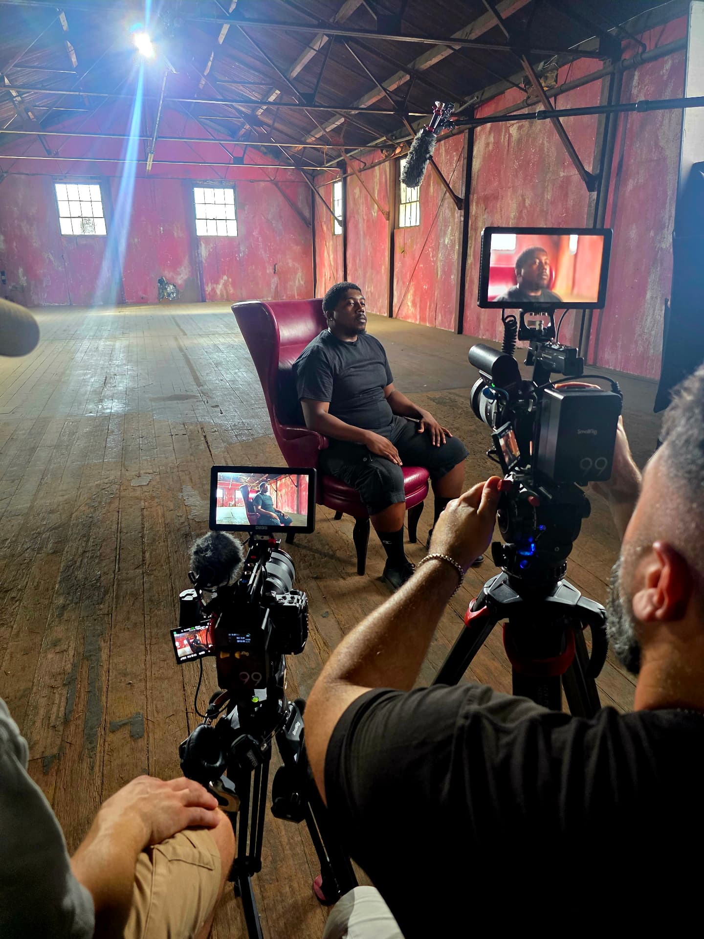 Behind the scenes with Montage Media Production Company: Two camera interview setup inside the warehouse