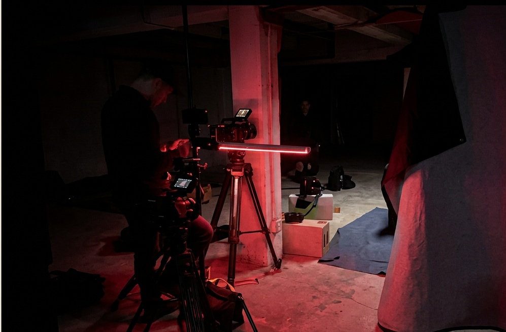 Practical red lighting on a night interior setup, photographed on location with E'Ian West and the Montage Media Production Company team