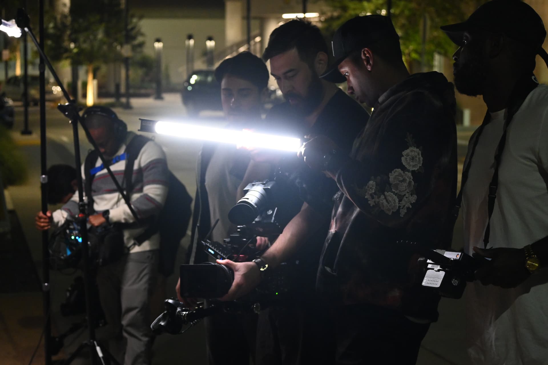 Behind the scenes with Montage Media Production Company: Night exterior setup with a handheld tube light