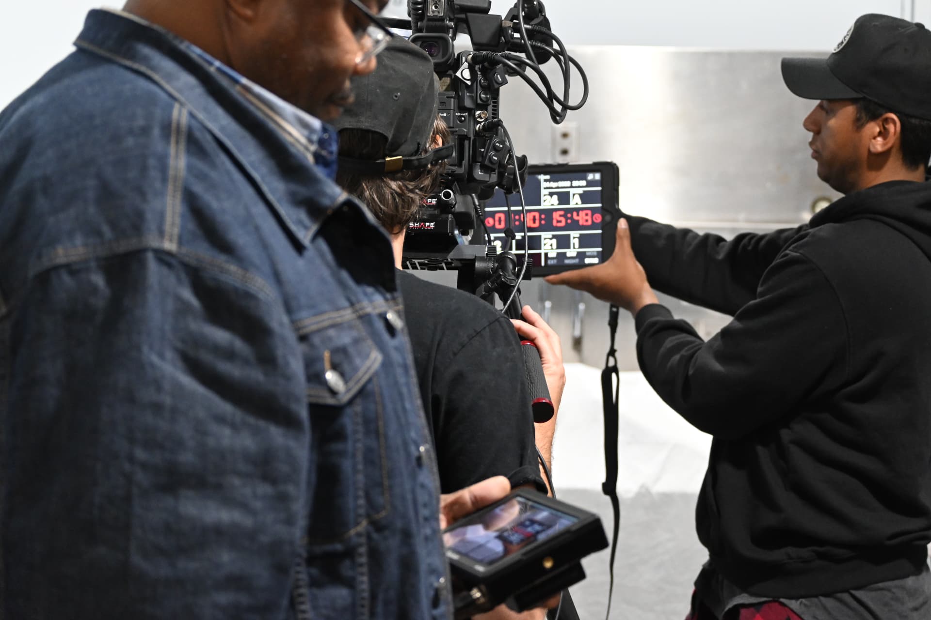 Behind the scenes with Montage Media Production Company: Timecode slate and camera team between takes