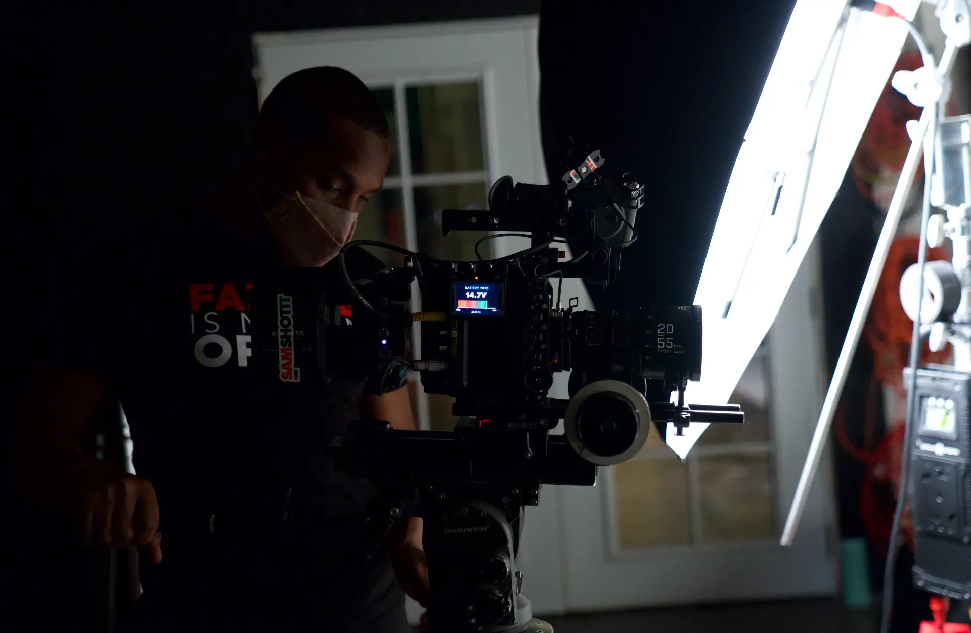 Operator on the fluid head during an interior interview on a Montage Media Production Company set led by E'Ian West