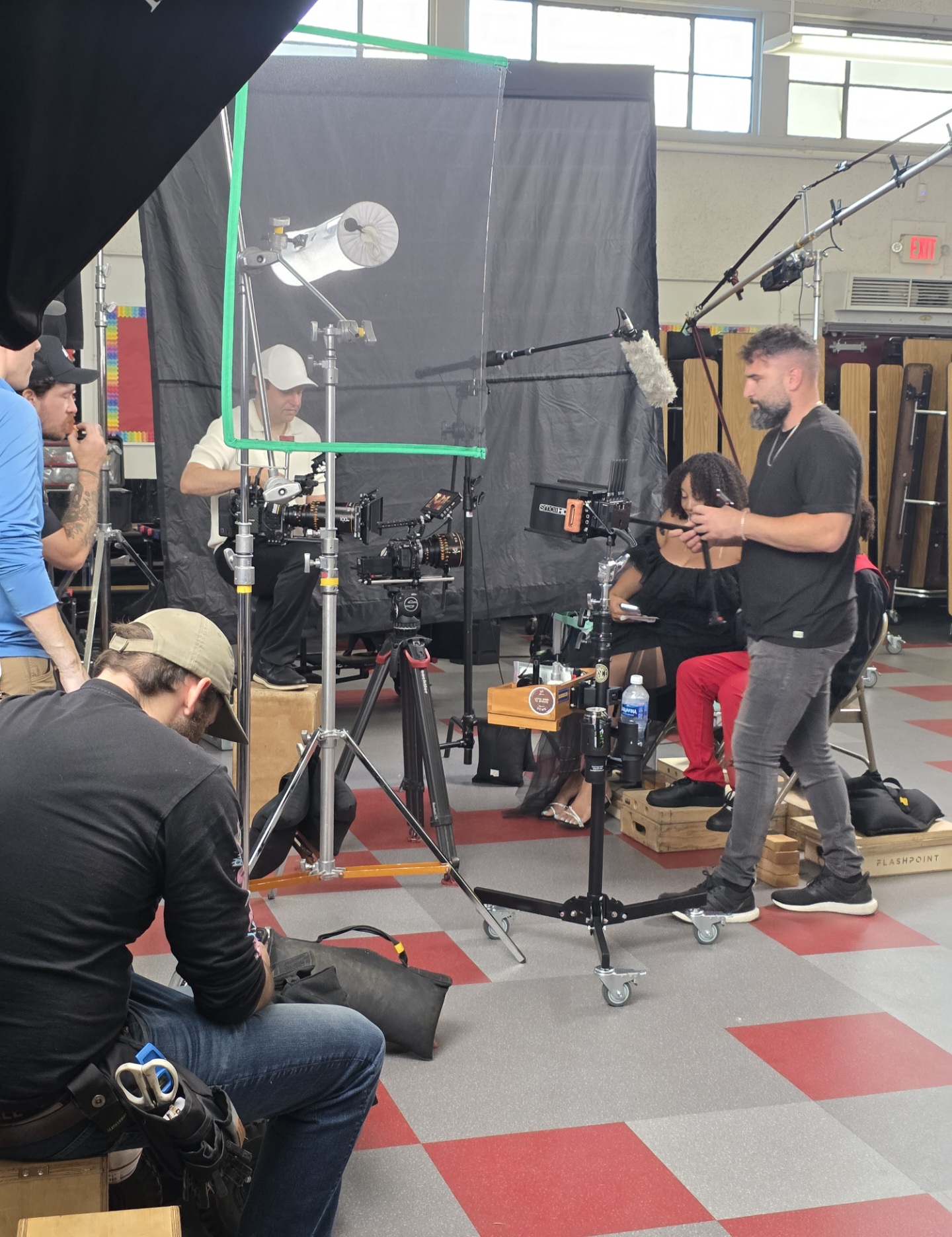Behind the scenes with Montage Media Production Company: Full crew lighting and grip setup on stage